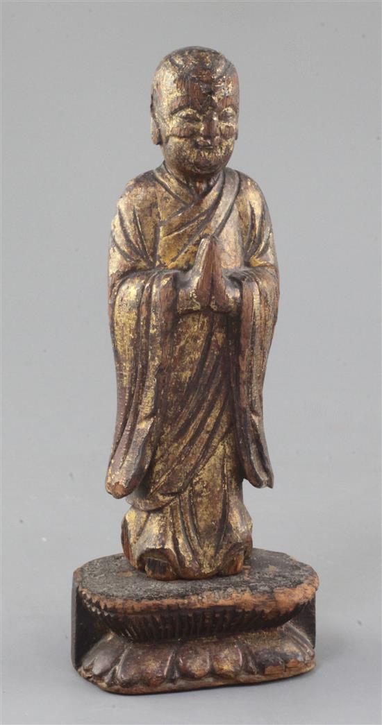 A Chinese giltwood figure of a Luohan, Ming dynasty or earlier, height 21.5cm